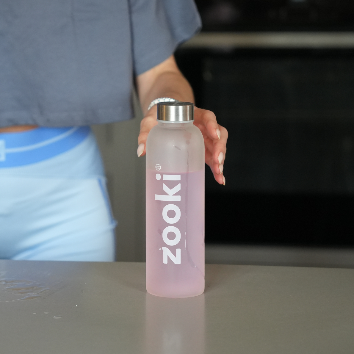 Non-gym woman preparing creatine drink at home, highlighting how creatine helps boost energy, mental clarity, and overall well-being for everyday women who don’t lift weights or go to the gym.